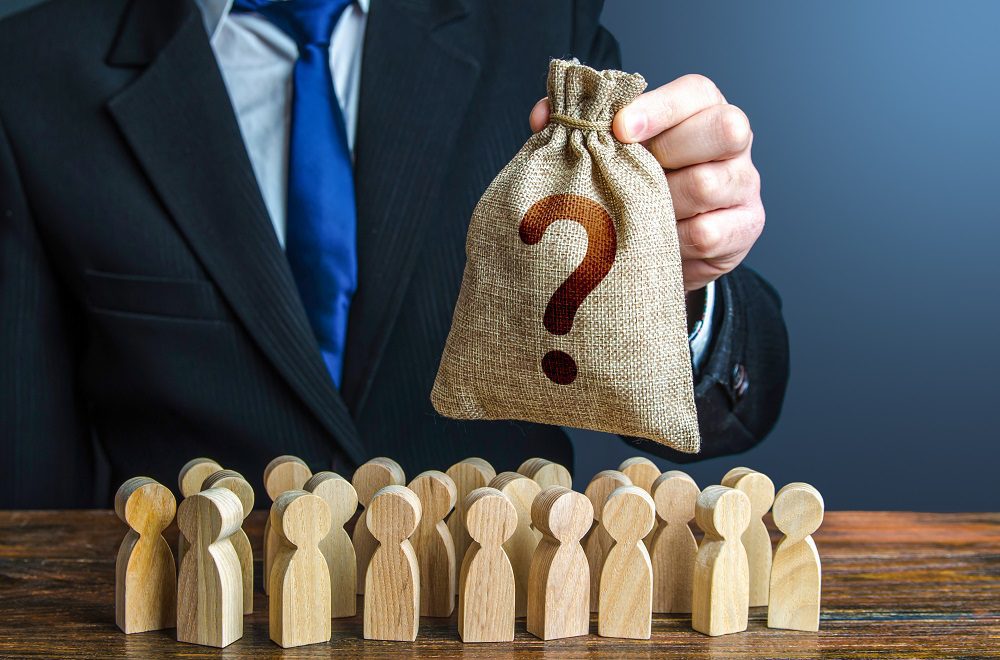 salary packaging - a silver bag with a question mark below the wooden men figures